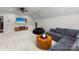 Large bonus room featuring a comfy sectional, TV and contemporary decor at 7811 Compton Ct, Charlotte, NC 28270
