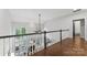 Bright hallway with fireplace view below and lots of light at 7811 Compton Ct, Charlotte, NC 28270