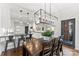 Open-concept kitchen features a breakfast bar and dark wood dining table at 7811 Compton Ct, Charlotte, NC 28270