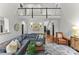Bright living room with a gray couch, hardwood floors, and a view of the second story at 7811 Compton Ct, Charlotte, NC 28270