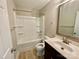 Full bathroom featuring tub with shower, modern vanity and updated fixtures at 915 Klondale Ave, Kannapolis, NC 28081