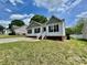 Charming home with white siding, black shutters, and a well-manicured front lawn at 915 Klondale Ave, Kannapolis, NC 28081