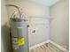 Functional utility room with water heater and shelving, for laundry and storage at 915 Klondale Ave, Kannapolis, NC 28081