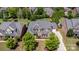 Aerial view of a beautiful home with a well-manicured lawn and mature trees at 10202 Alouette Dr, Waxhaw, NC 28173