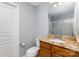 Bathroom with single sink vanity, granite countertops and shower with sliding glass door at 10202 Alouette Dr, Waxhaw, NC 28173