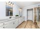 Bathroom features double vanity, marble countertops, and a tiled walk-in shower at 10202 Alouette Dr, Waxhaw, NC 28173