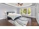 Serene bedroom with ample natural light, tray ceiling and hardwood floors at 10202 Alouette Dr, Waxhaw, NC 28173