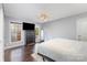 Bedroom with wood floors, natural light from the window, and a classic dresser at 10202 Alouette Dr, Waxhaw, NC 28173