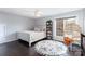 Comfortable bedroom with hardwood floors, and a cozy seating area at 10202 Alouette Dr, Waxhaw, NC 28173