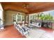 Spacious covered patio with outdoor seating, ceiling fan and built-in grill area at 10202 Alouette Dr, Waxhaw, NC 28173