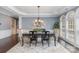 Formal dining room featuring a coffered ceiling, hardwood floors, and elegant decor at 10202 Alouette Dr, Waxhaw, NC 28173