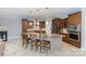 Modern kitchen with stainless steel appliances, a large island with seating, and granite countertops at 10202 Alouette Dr, Waxhaw, NC 28173