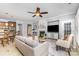 Inviting living room features a fireplace, tv, ceiling fan, and neutral color palette at 10202 Alouette Dr, Waxhaw, NC 28173
