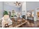 Spacious living room featuring tall ceilings, a fireplace, hardwood floors, and a large window at 10202 Alouette Dr, Waxhaw, NC 28173