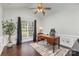 Bright office with a large window, hardwood floors, wainscoting and a wooden desk at 10202 Alouette Dr, Waxhaw, NC 28173