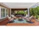 Charming outdoor living area with fire pit and comfortable seating under a pergola at 10202 Alouette Dr, Waxhaw, NC 28173