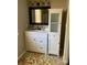 Bright bathroom with a sleek vanity, decorative mirror, and a convenient storage cabinet at 11106 Harrowfield Rd, Charlotte, NC 28226
