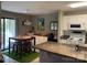 Bright and open kitchen area with a view of the dining space and access to outdoor amenities at 11106 Harrowfield Rd, Charlotte, NC 28226