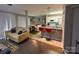 Open-concept kitchen and living area with a breakfast bar, perfect for modern living and entertaining guests at 11106 Harrowfield Rd, Charlotte, NC 28226