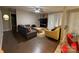 Comfortable living room with ceiling fan, brick accent wall, and sliding glass door access to the outdoors at 11106 Harrowfield Rd, Charlotte, NC 28226
