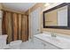Bright bathroom featuring a white vanity and shower with curtain at 11917 Chevis Ct, Charlotte, NC 28277