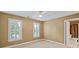 Bright bedroom featuring neutral carpeting and nearby bathroom at 11917 Chevis Ct, Charlotte, NC 28277