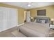 Inviting bedroom features a plush bed, soft lighting, and ample closet space for comfort at 11917 Chevis Ct, Charlotte, NC 28277