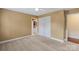 Bright bedroom with neutral carpeting, closet, and adjacent bathroom at 11917 Chevis Ct, Charlotte, NC 28277