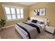 Bright bedroom with a large window, comfortable furnishings, and neutral carpet at 11917 Chevis Ct, Charlotte, NC 28277