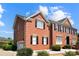 Classic brick home with black shutters and a two-car side entry garage at 11917 Chevis Ct, Charlotte, NC 28277