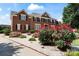 Brick home featuring lush flowering bushes at 11917 Chevis Ct, Charlotte, NC 28277