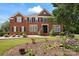 Inviting brick home with manicured lawn and garden at 11917 Chevis Ct, Charlotte, NC 28277