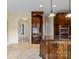Bright, open kitchen featuring stainless appliances, wood cabinetry and tile flooring at 11917 Chevis Ct, Charlotte, NC 28277
