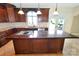 Kitchen island with cooktop and room for stools at 11917 Chevis Ct, Charlotte, NC 28277