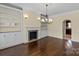 Charming living room with fireplace, built-in shelves, and hardwood floors at 11917 Chevis Ct, Charlotte, NC 28277