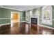 Living room with fireplace and large windows at 11917 Chevis Ct, Charlotte, NC 28277