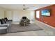 Relaxing living room featuring modern furnishings and a mounted TV for entertaining guests at 11917 Chevis Ct, Charlotte, NC 28277
