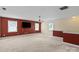This spacious living room features a ceiling fan and natural light at 11917 Chevis Ct, Charlotte, NC 28277