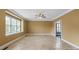 Large living room with big windows and tile floors at 11917 Chevis Ct, Charlotte, NC 28277
