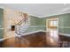 Spacious living room with hardwood floors and stairs at 11917 Chevis Ct, Charlotte, NC 28277