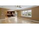 Spacious living room with tile floors, large windows, and an archway to the kitchen at 11917 Chevis Ct, Charlotte, NC 28277