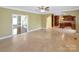 Open living room with tiled floor and seamless flow into kitchen and living spaces at 11917 Chevis Ct, Charlotte, NC 28277