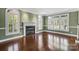 Living room featuring hardwood floors and fireplace at 11917 Chevis Ct, Charlotte, NC 28277