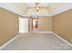 Bright main bedroom with a door to the main bathroom and neutral wall-to-wall carpeting at 11917 Chevis Ct, Charlotte, NC 28277