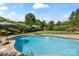 Sparkling in-ground pool offers a refreshing escape, nestled within a private and verdant backyard oasis at 11917 Chevis Ct, Charlotte, NC 28277