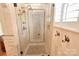 Detailed view of the glass-enclosed shower featuring beautiful tile work and bronze fixtures at 11917 Chevis Ct, Charlotte, NC 28277