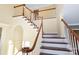 Traditional staircase with wood and white risers at 11917 Chevis Ct, Charlotte, NC 28277