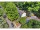 Aerial view showing the house with mature trees and a well-maintained neighborhood at 12328 Chickasaw Dr, Huntersville, NC 28078