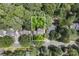 Aerial view of a home nestled amongst lush greenery, providing a serene and private setting at 12328 Chickasaw Dr, Huntersville, NC 28078