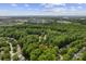 Overhead view of neighborhood showcasing community, surrounded by dense trees at 12328 Chickasaw Dr, Huntersville, NC 28078